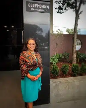Dr Marilyn Clark stands outside Djeembana